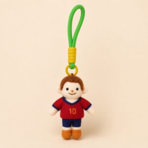 Custom felt sports doll keychain handmade from a photo with personalized team outfit